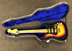 A vintage Hondo II electric guitar in hard case CONDITION REPORT: Case a/f.