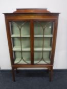 A Victorian inlaid mahogany double door display cabinet