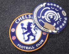 Two cast metal football plaques
