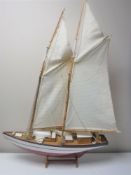 A wooden yacht on stand