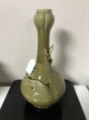 A Christopher Dresser designed vase, olive green with Art Nouveau style salamander detailing,