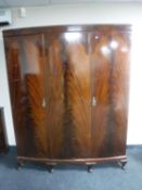 A mahogany Queen Anne style triple door wardrobe