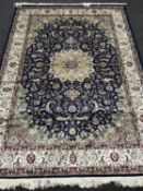 A Keshan carpet on blue ground,