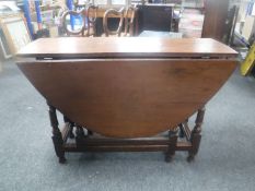 A Victorian oak gate leg table