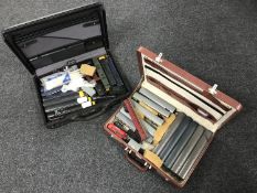 Two briefcases containing assorted Hornby rolling stock - coal and diesel engines,