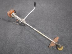 A Stihl petrol strimmer and a Trend tool bag with 110 volt transformer