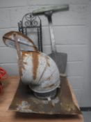 A metal flue together with a peat shovel,