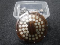 A plastic tub of assorted English and foreign coins - crowns etc