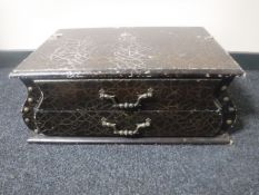 A wooden two drawer chest in leather effect finish