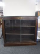 A set of Edwardian mahogany sliding door bookshelves with ormolu mounts