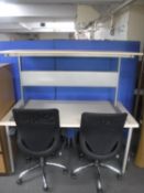 Two PC desks and a pair of swivel office chairs