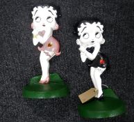 A pair of cast metal door stops 