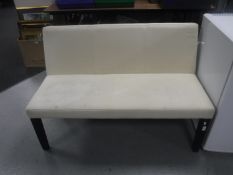 A reception settee in beige fabric