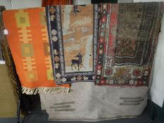 A fringed carpet and four fringed Persian design rugs