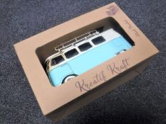 A boxed metal model of a camper van