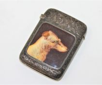 An antique silver and enamel vesta case depicting a setter,