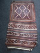 An antique kilim flat weave saddle rug,