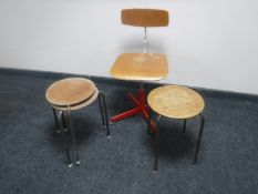 A mid 20th century teak swivel typist's chair and three metal legged stools