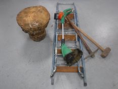 A set of folding metal steps, electric strimmer, pick axe,