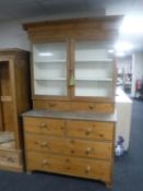 An antique pine double door kitchen cabinet