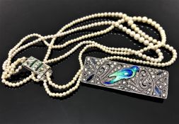 A silver and marcasite brooch with enamelled bird,