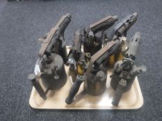 Seven vintage blow lamps.