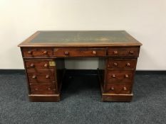 A Victorian mahogany twin pedestal desk fitted nine drawers