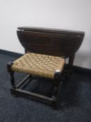 An oak drop leaf coffee table and a rush seated stool