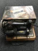 A mid 20th century Singer sewing machine together with a boxed Goblin Teasmade