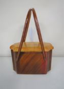A mid 20th century celluloid trinket box in the form of a hand bag