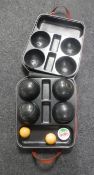 A set of four Dunlop Standard Woolf lawn bowls in case