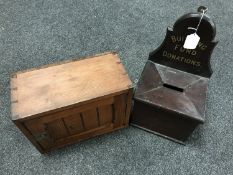 A vintage wooden building fund donation box and an antique pine wall cabinet