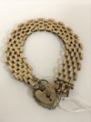 A 9ct gold padlock bracelet CONDITION REPORT: 12g