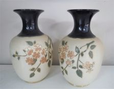 A pair of Royal Doulton glazed pottery vases,
