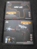 Two boxed Regimental Police mini uzi water guns