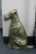 A brass door stop in the form of a terrier