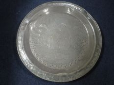 An Eastern brass wall plaque