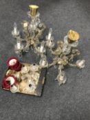 Two early 20th century continental glass chandeliers with drops together with a pair of similar