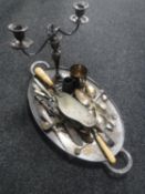 An antique silver plated twin-handled tray together with assorted flatware, table candelabra,
