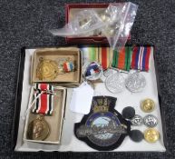 An interesting collection of WWII medals, commemorative medals, military buttons, badges etc.