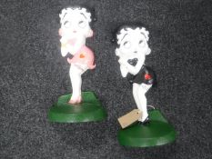 A pair of cast metal door stops 