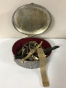 A metal box containing wristwatches,