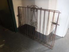 A pair of wrought iron garden gates