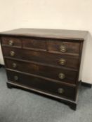 A George III mahogany chest of six drawers on bracket feet,