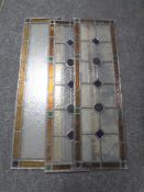 Two pairs of narrow antique stained glass windows