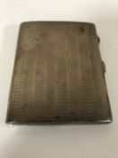 A silver cigarette case, the front initialled 'DH', Birmingham marks 20th century, 88.9g.