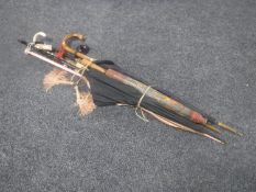 A bundle of six vintage parasols including a Chinese example,