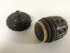 An antique carved coquilla nut nutmeg grater CONDITION REPORT: Bone ring intact.