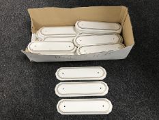 A box of ceramic finger plates