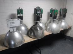 Seven fawn industrial halogen lights and one other